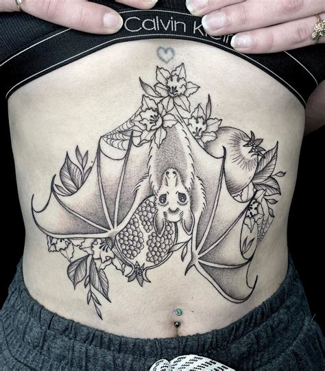 breast bone tattoo|sternum tattoo for large breasts.